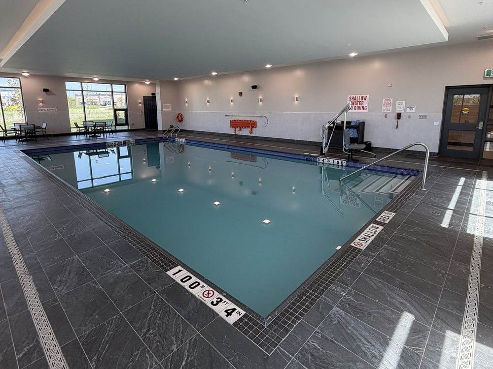 Shallow end of the lesson pool, 3 ft 4 in deep, marked on the deck