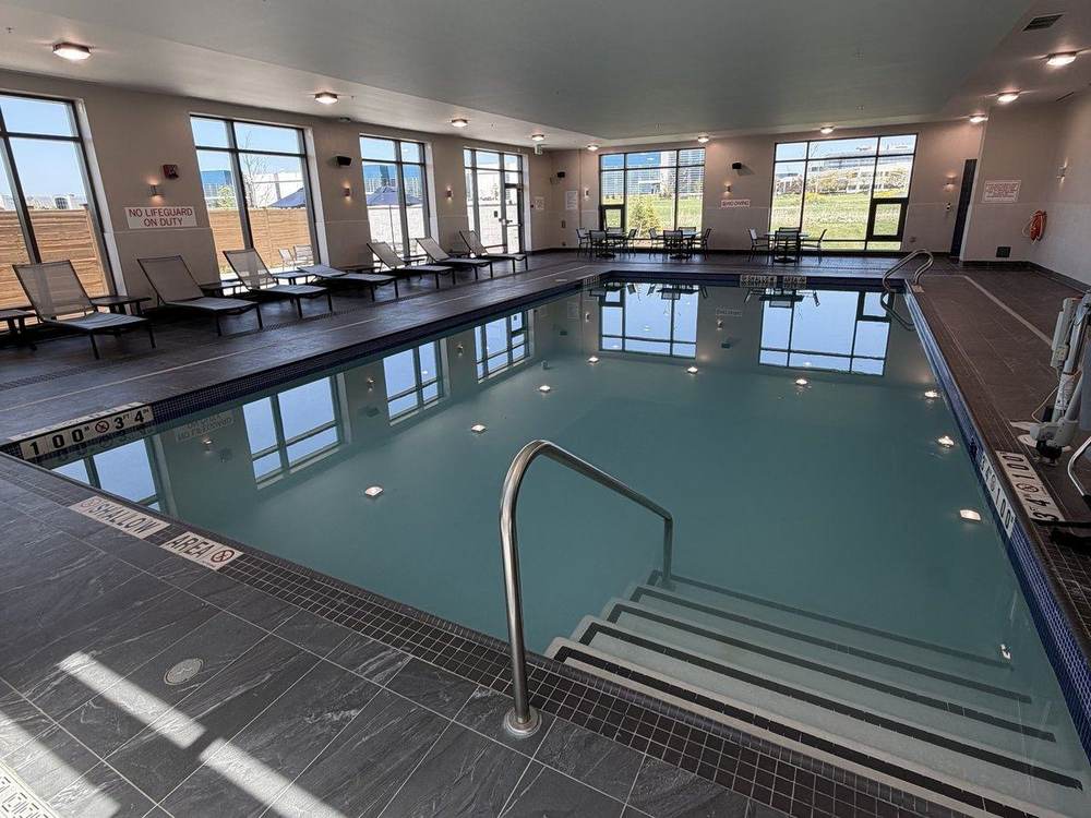 Shallow entry steps with handrail into the lesson pool, where many lessons and technique drills happen