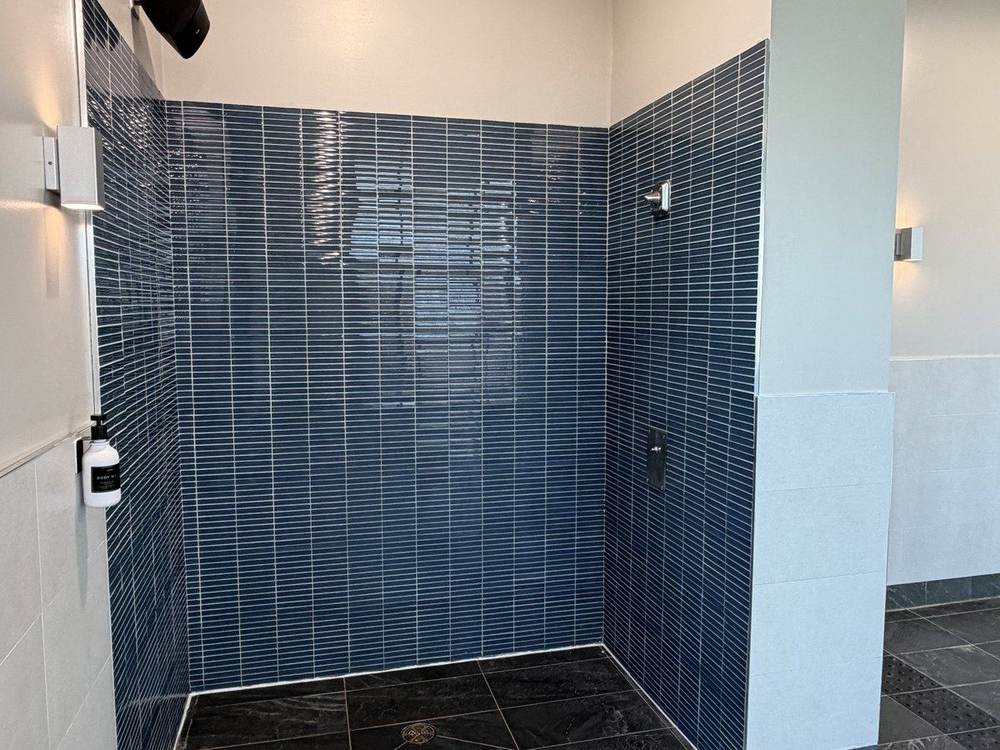 Showers beside the pool at 5100 Satellite Drive